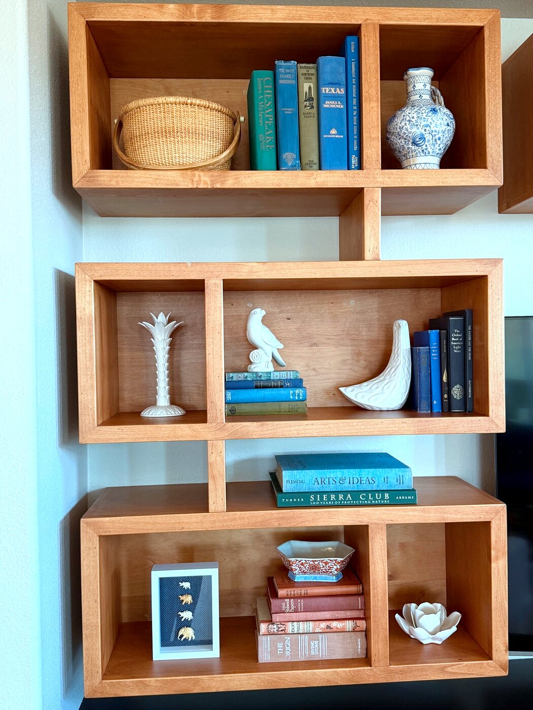 Vertical view of the custom built-in bookshelf with keepsakes