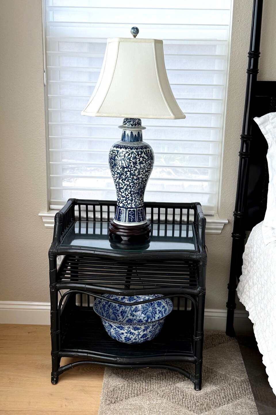 A nightstand vignette in a Central Coast home: the small surfaces matter as much as the shelves.